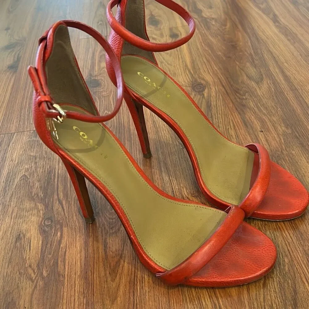 Coach reddish orange high heels strap ankle strap with gold hardware. Size 7 lea